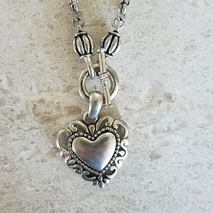 Necklace with heart pendant.